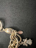 Gold-tone jewelry collection with heart pendant, charm bracelet, and drop earrings - thumbnail 13 of 18
