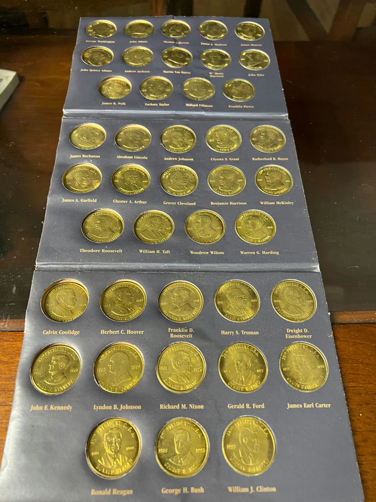 Blue album of U.S. Presidents coins - image 4 of 5