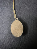Gold-tone cameo pendant necklace with floral center, purple chip earrings, and two-tone circular earrings - thumbnail 5 of 11