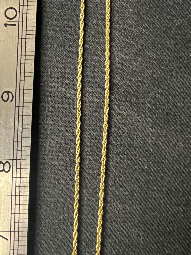 Three necklaces: gold-tone pendant necklace, silver-toned necklace, and multicolor beaded necklace - image 7 of 11