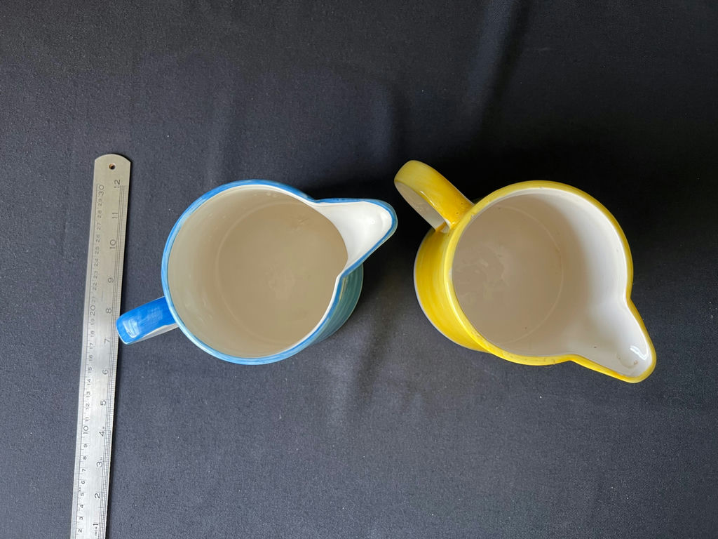 Pair of small ceramic pitchers with blue and yellow floral glaze - image 2 of 4