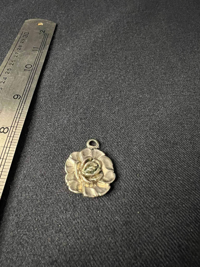 Assorted pendants: flower, shell, and cabochon disk - image 1 of 10