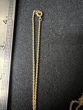 Gold-tone cameo pendant necklace with floral center, purple chip earrings, and two-tone circular earrings - thumbnail 6 of 11