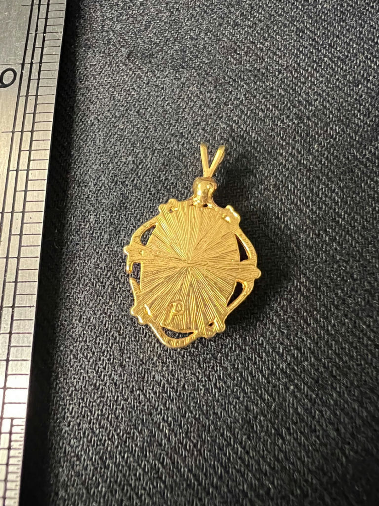 Gold-tone oval cameo pendant with profile portrait - image 2 of 5