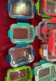 Assorted glass and plastic food storage containers with colorful lids - thumbnail 3 of 6