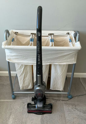 Rolling Hamper And Lightweight Vacuum - Image 1 of 7