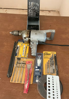 Vintage corded electric drill with assorted drill bits and accessories - Image 1 of 5