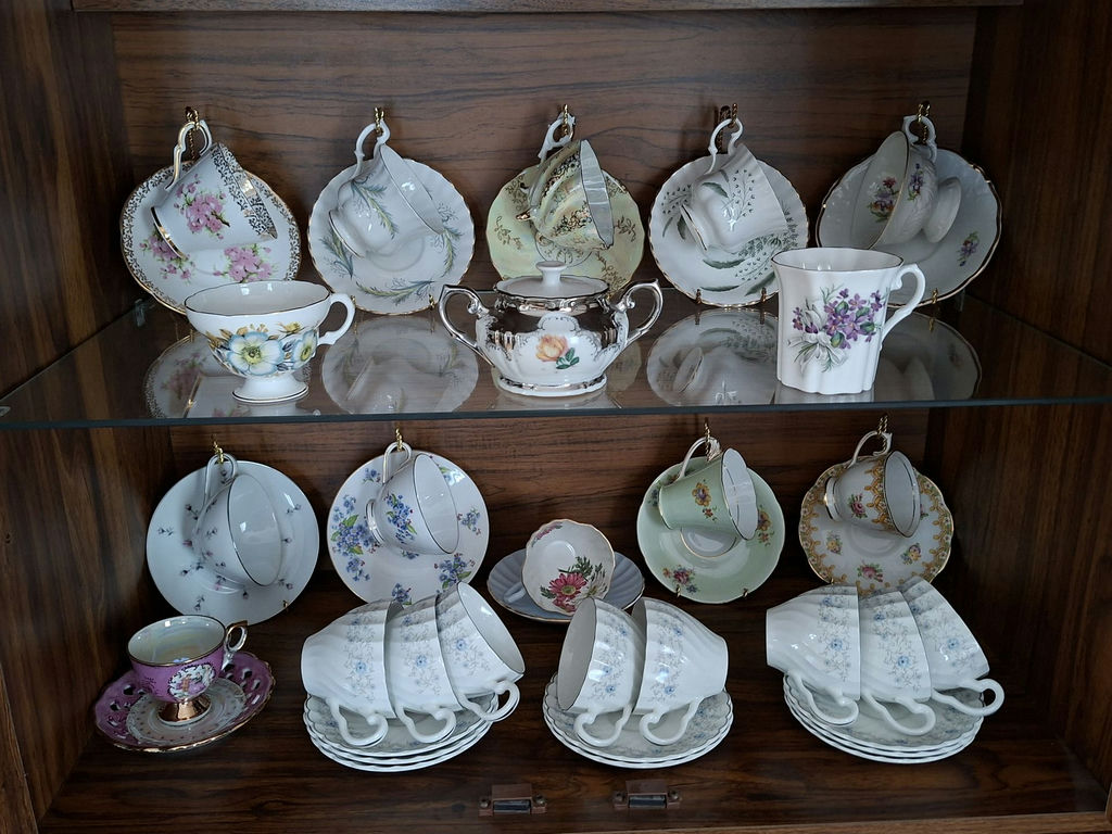 Assorted Floral China Teacups, Saucers, Sugar Bowl, and Creamer - image 1 of 10