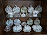 Assorted Floral China Teacups, Saucers, Sugar Bowl, and Creamer - thumbnail 1 of 10