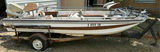 Aluminum fishing boat on trailer with outboard motor - thumbnail 1 of 9