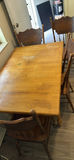 Wooden dining table with carved-back chairs - thumbnail 1 of 4