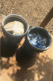 Assorted workshop waste and welding supplies in trash containers - thumbnail 1 of 9