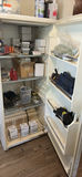 White upright refrigerator with assorted stored items - thumbnail 2 of 4