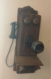 Vintage wall-mounted ship wheel clock, antique telephone, and wooden wall rack - thumbnail 3 of 8
