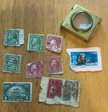 Vintage US stamps and brass magnifier - thumbnail 1 of 4