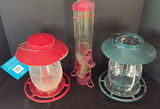 Assorted household items: lanterns, bird feeder, glassware jars, framed art, scale and hardware - thumbnail 1 of 16