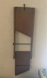 Vintage wall-mounted ship wheel clock, antique telephone, and wooden wall rack - thumbnail 7 of 8