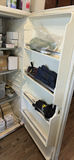 White upright refrigerator with assorted stored items - thumbnail 3 of 4