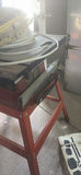 SkilSaw table saw on red work stand with coiled cables - thumbnail 5 of 6
