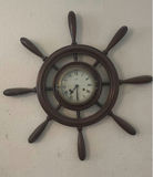 Vintage wall-mounted ship wheel clock, antique telephone, and wooden wall rack - thumbnail 5 of 8