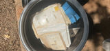 Assorted workshop waste and welding supplies in trash containers - thumbnail 2 of 9