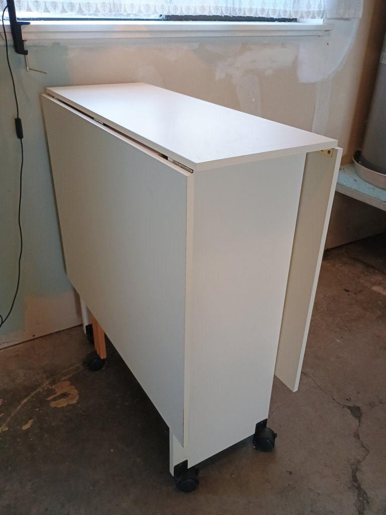 White foldable table with central pedestal and wooden legs on casters - image 6 of 6