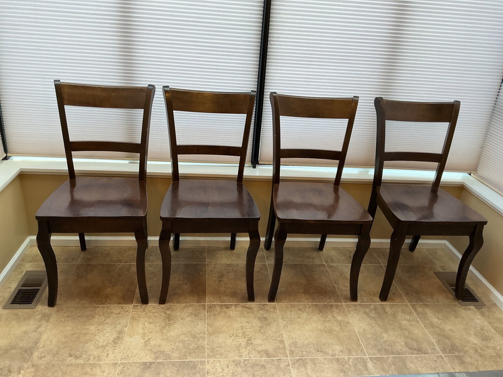 Dark wood dining table with four matching chairs - image 4 of 5