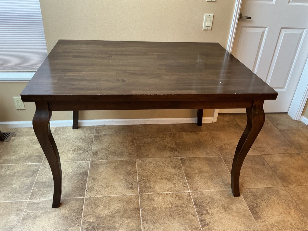 Dark wood dining table with four matching chairs - image 2 of 5