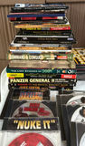 Collection of PC game discs, strategy guides, and magazines - thumbnail 2 of 5