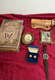 Faux Antique book Box, framed photos, cufflinks, wristwatch, and carved wooden object - thumbnail 1 of 9