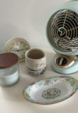 White round end table with vintage fan and assorted decorative items - thumbnail 2 of 6