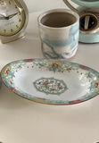 White round end table with vintage fan and assorted decorative items - thumbnail 5 of 6