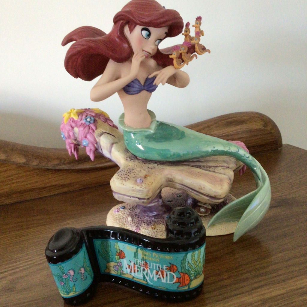 Ariel Mermaid figurine on rocky base with Little Mermaid film-strip decoration - image 1 of 4