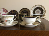 Assorted porcelain tea cups, teapots, and plates - thumbnail 2 of 13