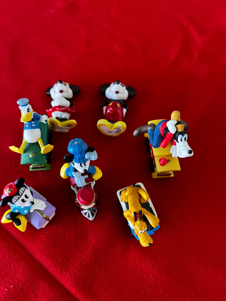 Disney character mini figurines on toy vehicles - image 1 of 2