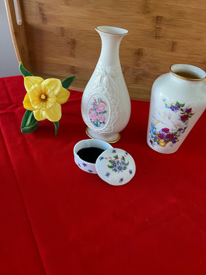 Floral porcelain vases, a small lidded container, and a yellow artificial daffodil - Image 1 of 2