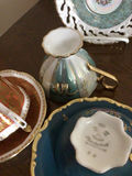 Assorted porcelain tea cups, teapots, and plates - thumbnail 12 of 13