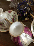 Assorted porcelain tea cups, teapots, and plates - thumbnail 11 of 13
