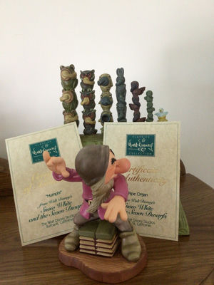 Dopey figurine with a decorative green pipe organ and totem-pole sculptures - Image 1 of 6
