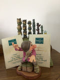 Dopey figurine with a decorative green pipe organ and totem-pole sculptures - thumbnail 1 of 6