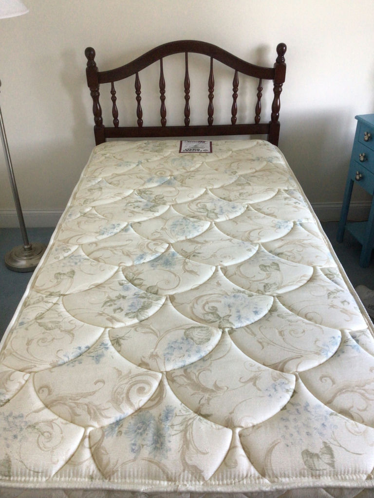 Wooden spindle-headboard bed with quilted mattress  - image 1 of 2