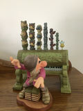 Dopey figurine with a decorative green pipe organ and totem-pole sculptures - thumbnail 2 of 6