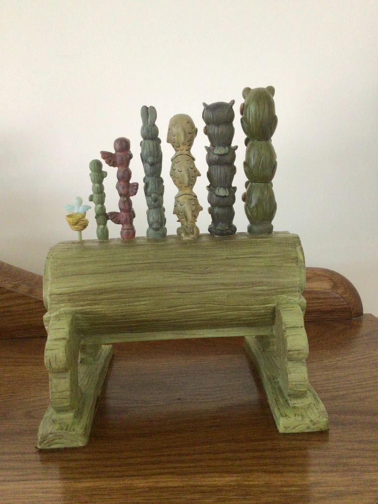 Dopey figurine with a decorative green pipe organ and totem-pole sculptures - image 4 of 6