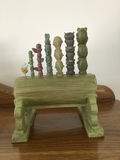 Dopey figurine with a decorative green pipe organ and totem-pole sculptures - thumbnail 4 of 6