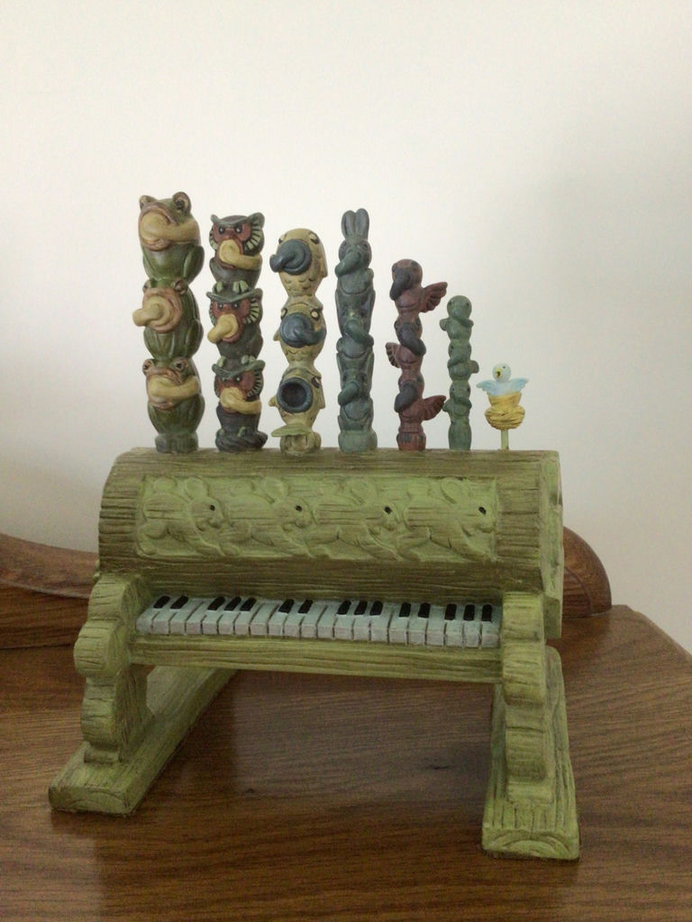 Dopey figurine with a decorative green pipe organ and totem-pole sculptures - image 3 of 6