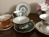 Assorted porcelain tea cups, teapots, and plates - thumbnail 7 of 13