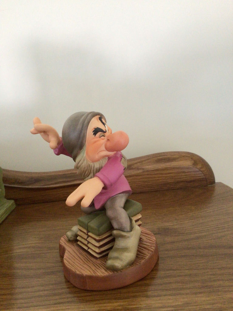 Dopey figurine with a decorative green pipe organ and totem-pole sculptures - image 6 of 6