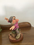 Dopey figurine with a decorative green pipe organ and totem-pole sculptures - thumbnail 6 of 6
