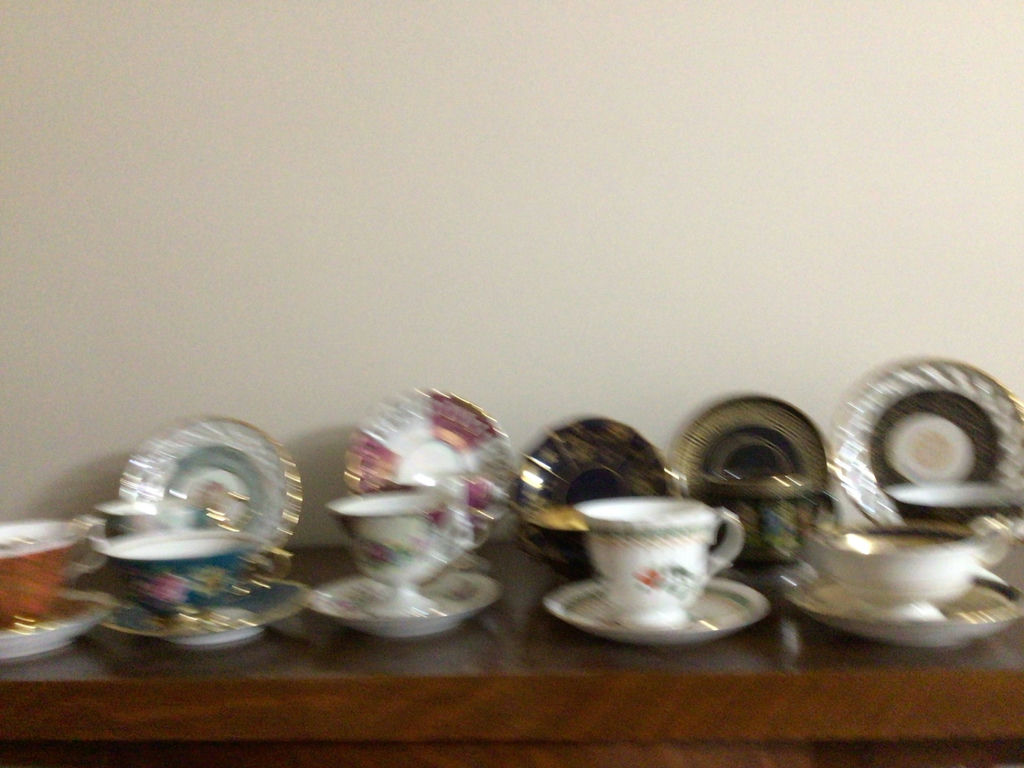 Assorted porcelain tea cups, teapots, and plates - image 1 of 13