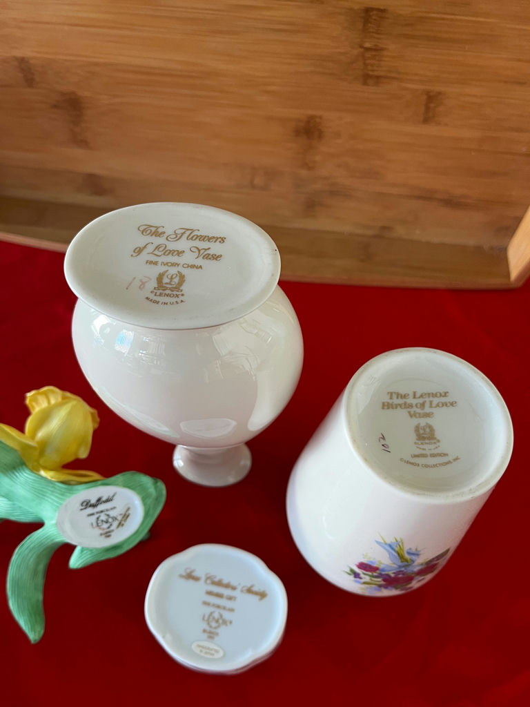 Floral porcelain vases, a small lidded container, and a yellow artificial daffodil - image 2 of 2